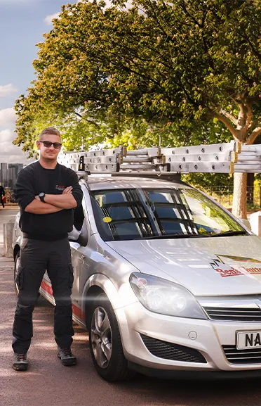 our gutter cleaner in London standing by company vehicle