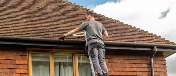 Gutter cleaning a residential property in Tower Hamlets